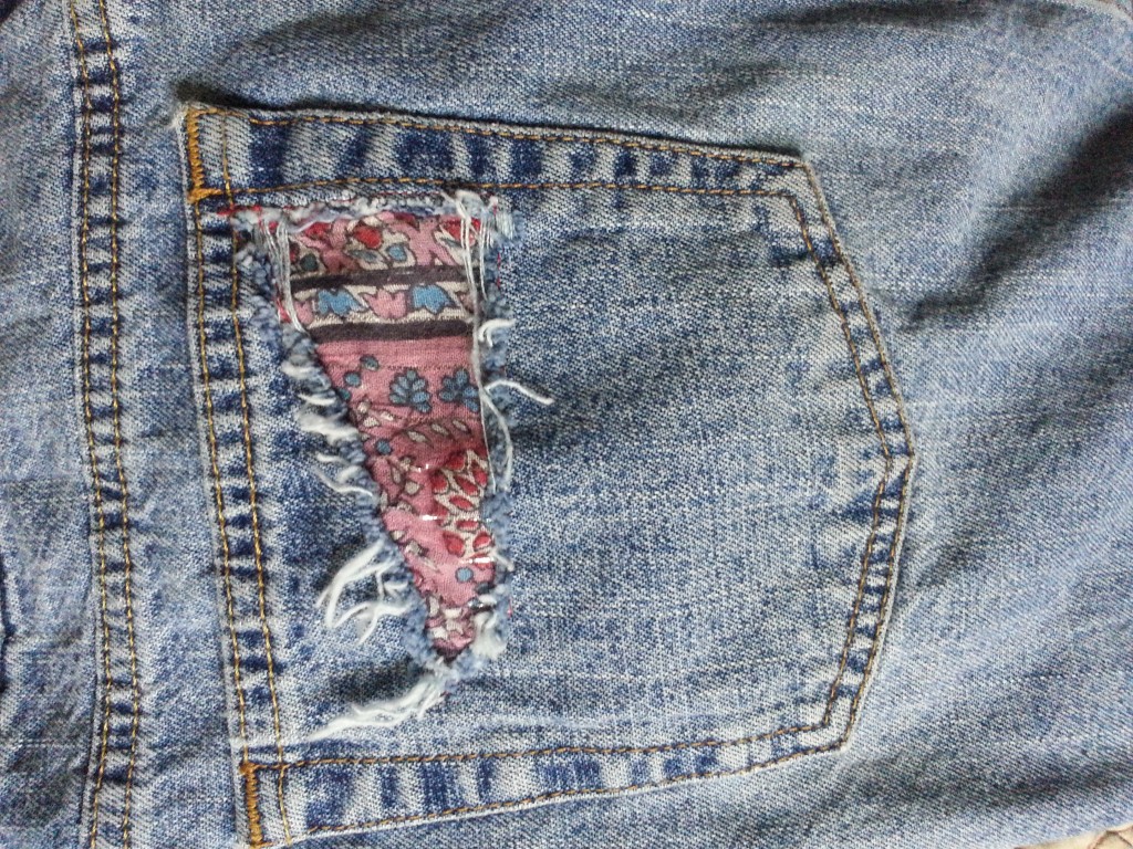 Upcycled denim skirt pocket patch.