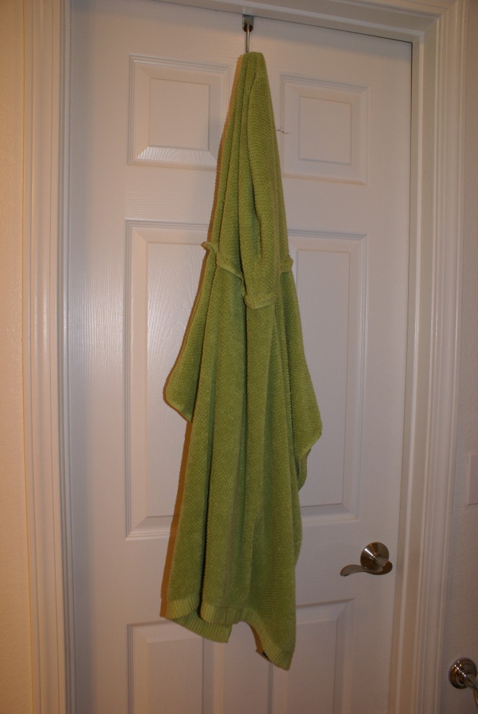 Hooded towel poncho hanging.