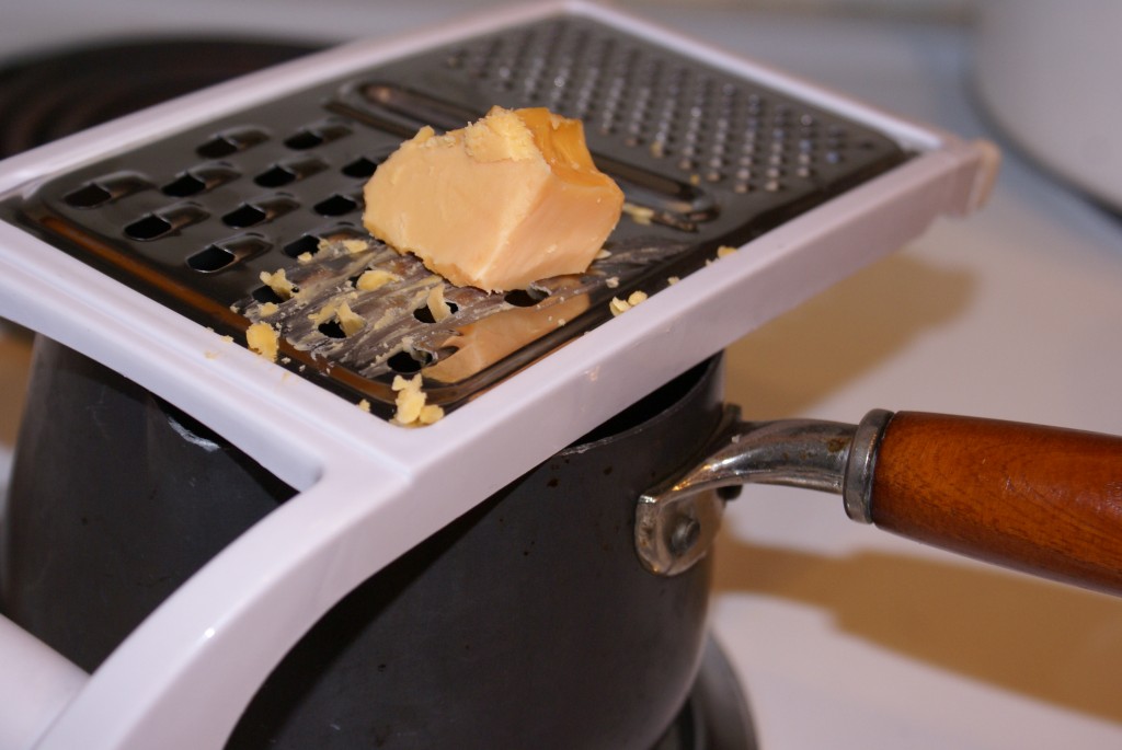 Grating cheese Grating cheese straight into the pot gets it melting sooner.
