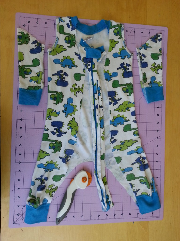Cut out zipper, cut off sleeves, cut open legs. Cut out zipper, cut off sleeves, cut open legs.