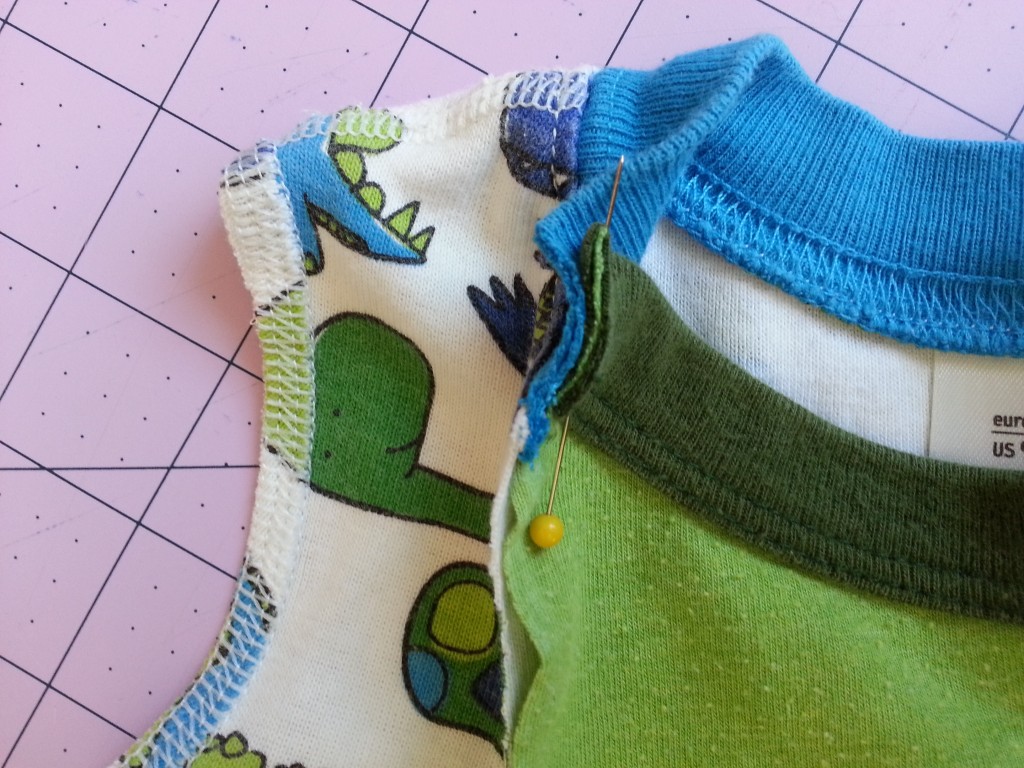 Pin pajamas to t-shirt fabric - inside to inside - to prepare for a folded back edge. Pin pajamas to t-shirt fabric - inside to inside - to prepare for a folded back edge.
