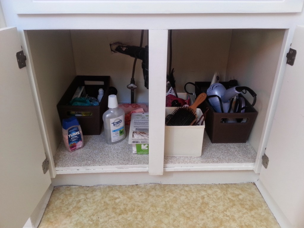 AFTER: No, put it in here, with a new piece of plywood and shelving paper laid down.