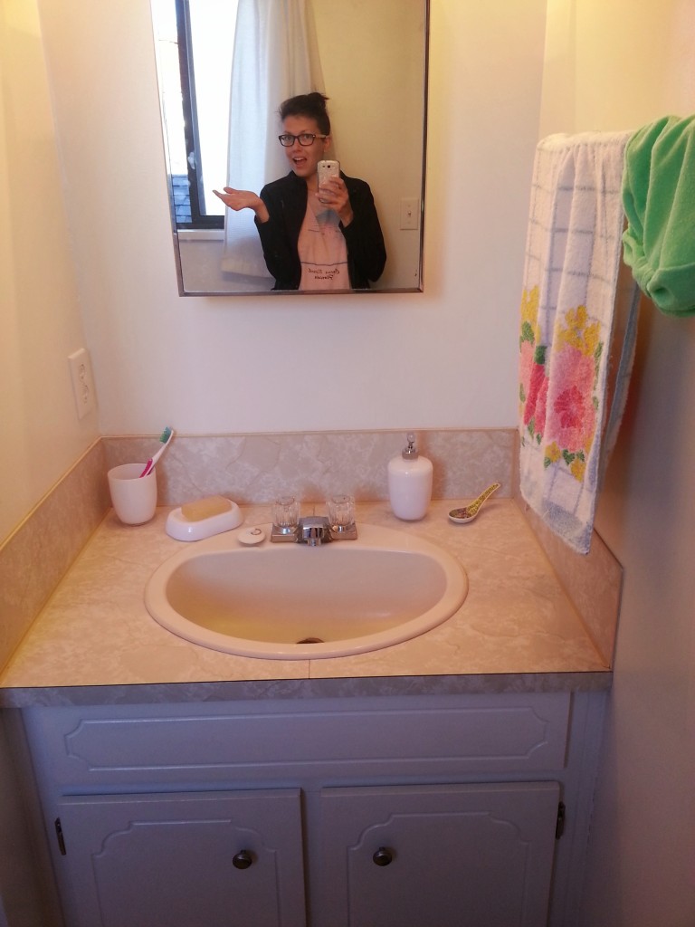 AFTER: Cleaned, painted, lightbulbs replaced, towel rack mounted, smiles!
