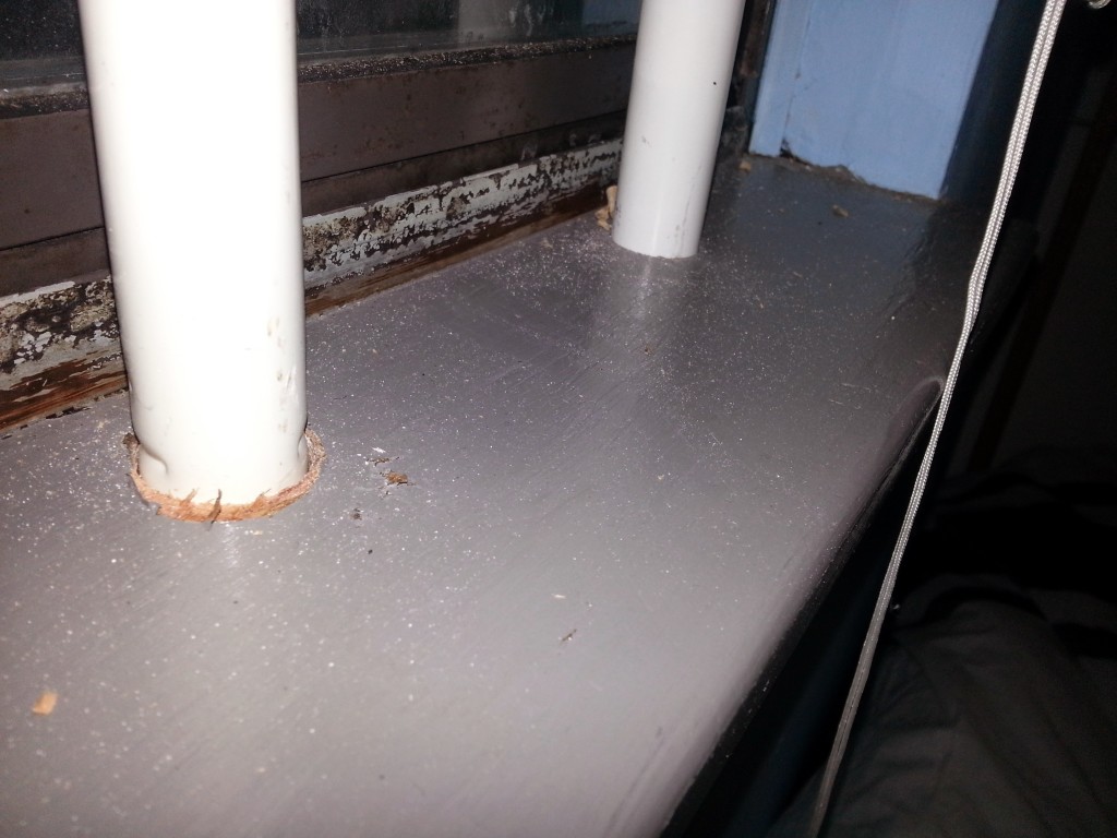 Bottom of the window frame.  Still a little dusty from drilling out the holes for the bars.