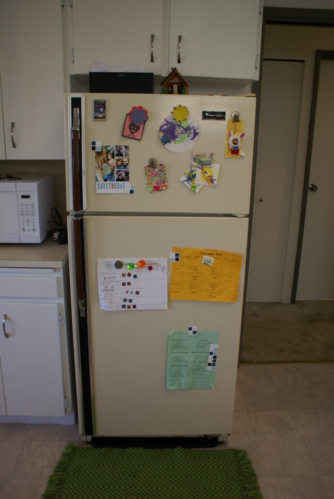 AFTER: Pretty cabinets and homey fridge.